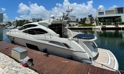 Luxury 64 ft Sunseeker Predator yacht cruising the stunning waters of St. Barts, St. Martin, and Sint Maarten. Combining power, luxury, and comfort for thrilling charters.