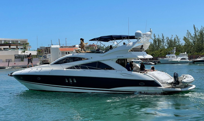 Luxury 64 ft Sunseeker Predator yacht cruising the stunning waters of St. Barts, St. Martin, and Sint Maarten. Combining power, luxury, and comfort for thrilling charters.